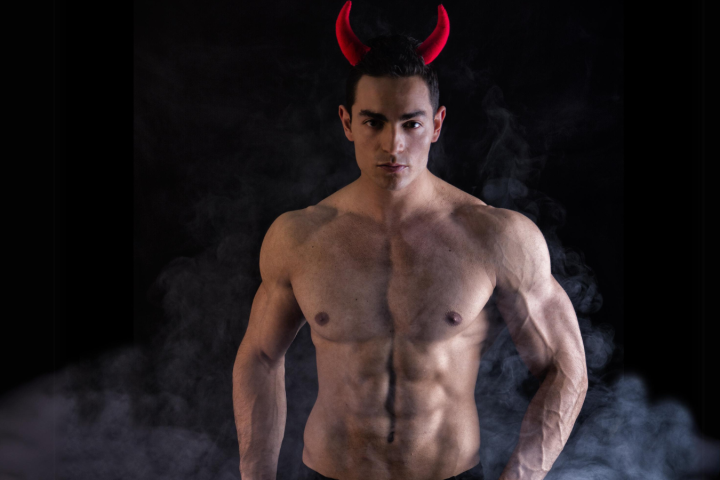 a man that is standing in the dark